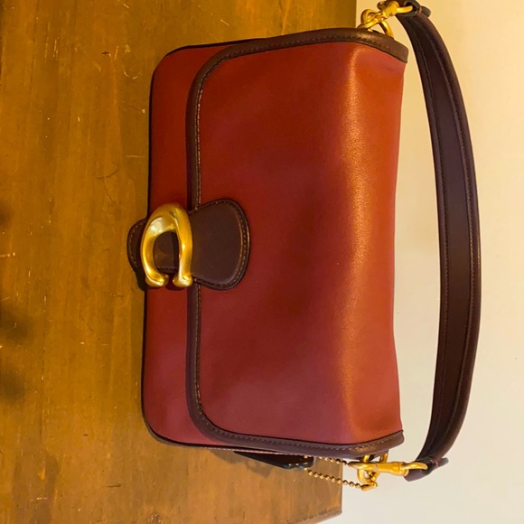 Coach Handbags - Coach bag, NWOT. Never used. Beautiful maroon color brown trim gold C clasp